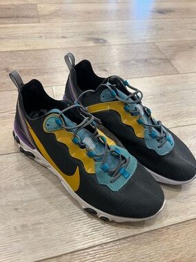 Nike Black Sneakers with Yellow Swoosh and Teal Accents